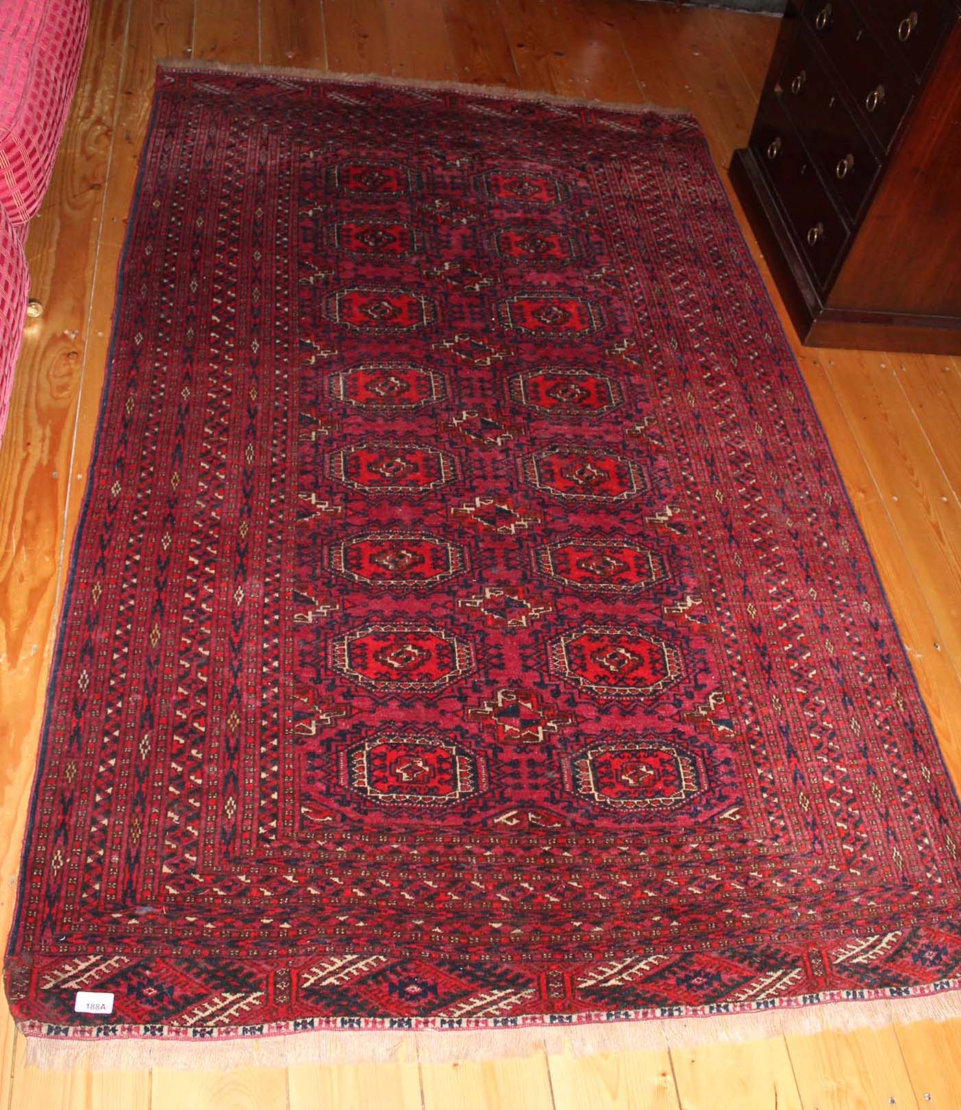 A BOKHARA STYLE RUG decorated with confo