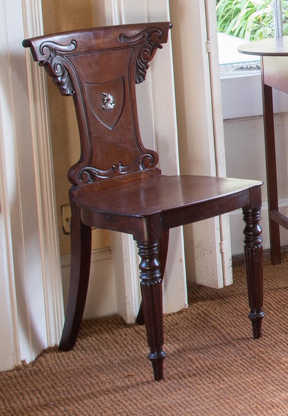 A PAIR OF GEORGIAN MAHOGANY HALL CHAIRS,