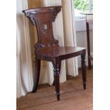 A PAIR OF GEORGIAN MAHOGANY HALL CHAIRS,