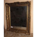 A GILT PLASTER WALL MIRROR, 60cm x 50cm