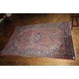 A Semi Antique Kashan Rug, with a red gr