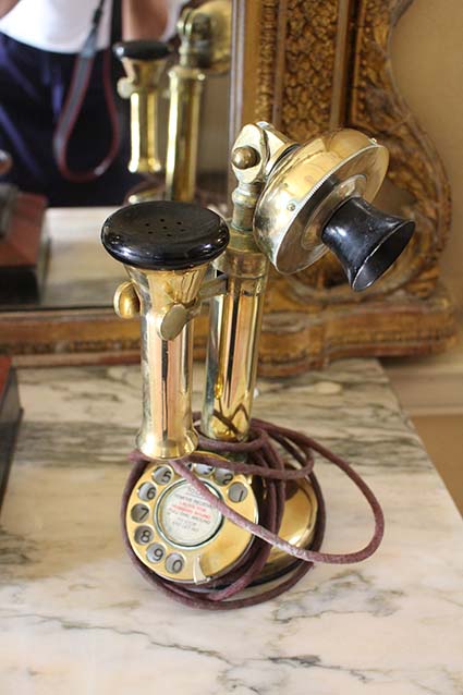 A BRASS MODEL OF A TELEPHONE RECEIVER, E