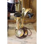 A BRASS MODEL OF A TELEPHONE RECEIVER, E