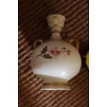 A ROYAL WORCESTER TWO HANDLED VASE, with