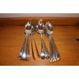 A SET OF 12 SERVING SPOONS, ENSUITE, SHE