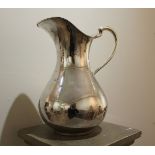 A FRENCH SILVER JUG, of plain baluster o