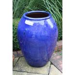 A BLUE CAMPANA VASE STICK STAND