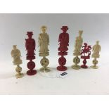 A LATE 19TH CENTURY CHINESE CANTONESE CARVED AND STAINED IVORY CHESS SET of figure form with puzzle