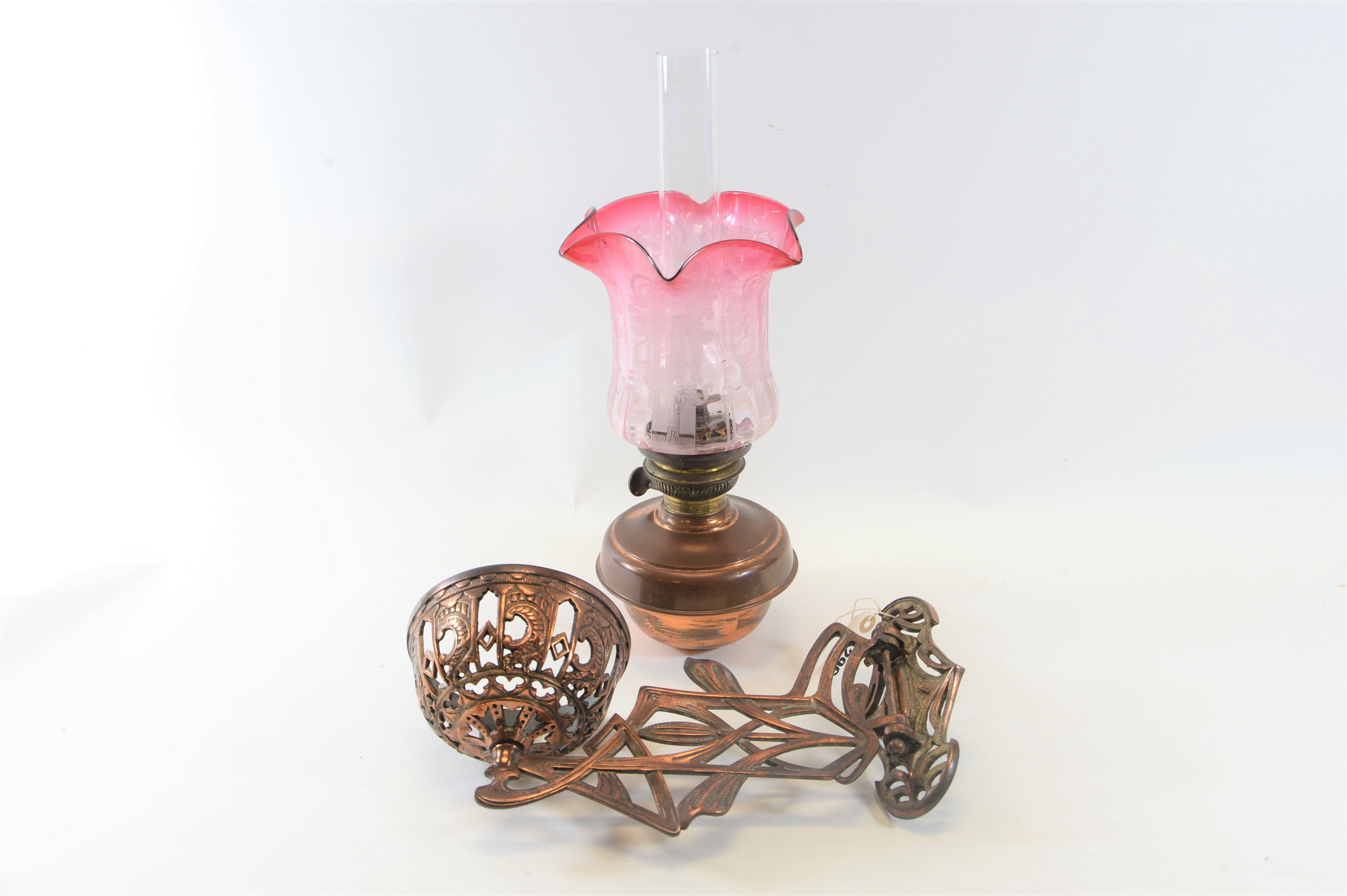 A LATE 19TH CENTURY ART NOUVEAU BRONZED CAST-IRON WALL OIL LAMP BRACKET with pierced foliate design,