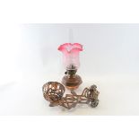 A LATE 19TH CENTURY ART NOUVEAU BRONZED CAST-IRON WALL OIL LAMP BRACKET with pierced foliate design,