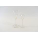 A PAIR OF GEORGIAN STYLE TRUMPET SHAPED WINE GLASSES with teardrop stems, 8 1/4 ins high,