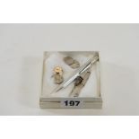 AN ELIZABETH II RETRACTABLE SILVER TOOTHPICK, Birmingham 1955, a white metal stone ended TOOTHPICK,