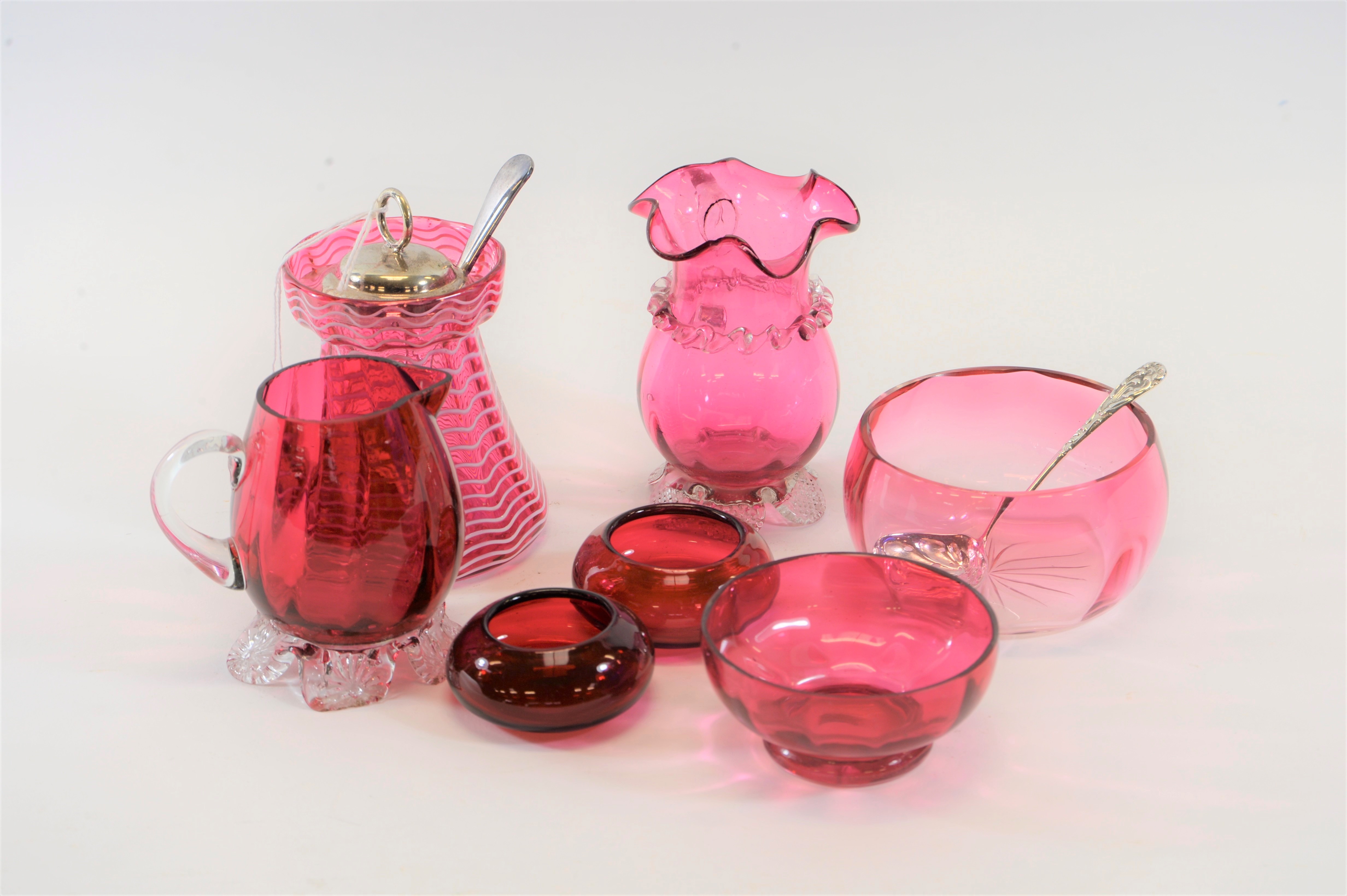 A VICTORIAN CRANBERRY GLASS PRESERVE JAR with white trailed decoration and e.p.n.