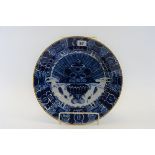 A PAIR OF 18TH CENTURY BLUE AND WHITE DUTCH DELFT DISHED PLATES decorated with a central jardinere