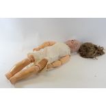 A LATE 19TH/EARLY 20TH CENTURY S & H "JUTTA" BISQUE HEADED DOLL with blonde hair,