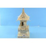 A LATE 19TH CENTURY CARVED CHINESE IVORY PAGODA SHAPED BUDDHIST SHRINE,