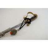 A GERMAN DRESS SWORD, the brass hilt with lions mask pommel and quillon,
