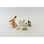 A ROYAL DOULTON PORCELAIN MODEL OF A SEATED ROUGH HAIRED TERRIER, 2 1/2 ins high,