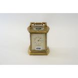 AN EARLY 20TH CENTURY BRASS REPEATING 8 DAY CARRIAGE CLOCK striking on a gong,