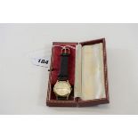 A GENTS 9CT GOLD GARRARD WRISTWATCH,