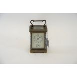 AN EARLY 20TH CENTURY BRASS 8 DAY CARRIAGE CLOCK with champleve enamel struts,