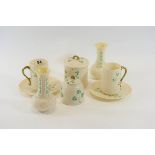 A PAIR OF MID 20TH CENTURY IRISH BELLEEK PORCELAIN SHAMROCK PATTERN FAUX BASKET WEAVE BEAKERS AND