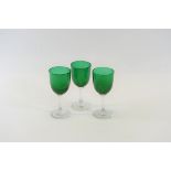 THIRTEEN LATE 19TH CENTURY GREEN BOWL WINE GLASSES with clear stems and circular foot-rings each 5