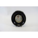 AN EDWARDIAN OVAL MINIATURE ON IVORY, head and shoulders of a Noble woman, unsigned,