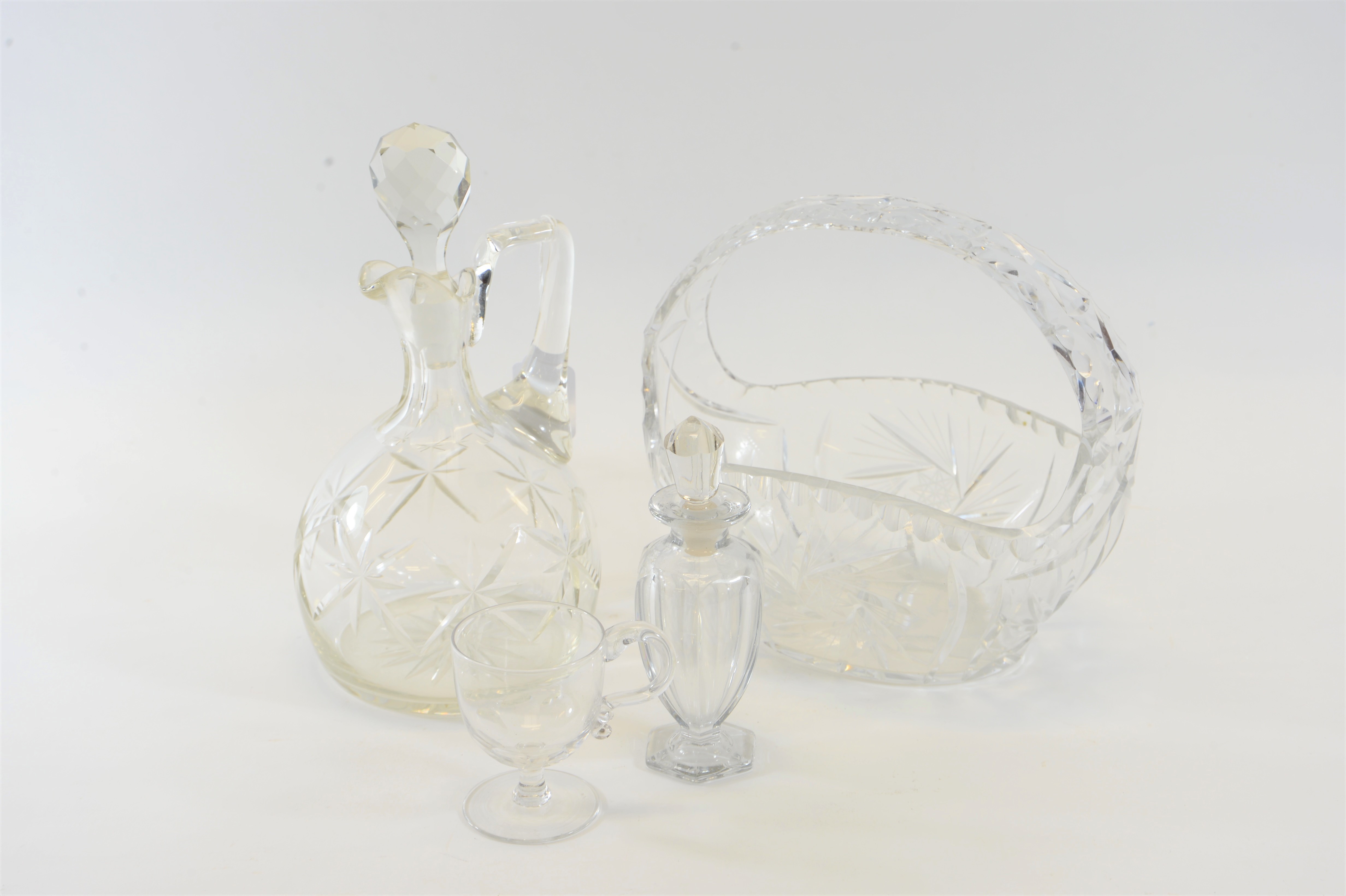 A LATE VICTORIAN/EDWARDIAN OVOID CUT-GLASS CLARET JUG AND STOPPER,