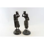 A PAIR OF LATE 19TH CENTURY SPELTER FIGURE FORM CANDLESTICKS of female and male form each holding