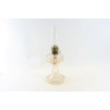 A LATE 19TH CENTURY CLEAR CUT GLASS TABLE OIL LAMP with integral circular base,