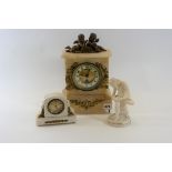 A LATE VICTORIAN ALABASTER GILT METAL MANTLE CLOCK, single train movement surmounted by putto,