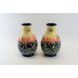 A PAIR OF 20TH CENTURY MOORCROFT INFLUENCE PORCELAIN VASES with tube-lined floral and butterfly