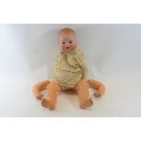 AN EARLY 20TH CENTURY GERMAN ARMAND MARSEILLE BISQUE HEADED BABY DOLL with moulded hair,