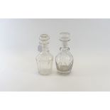 AN EARLY 19TH CENTURY CUT GLASS TRIPLE-RING NECK DECANTER AND STOPPER, 10 ins high,