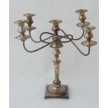 A silver plate 5 branch candelabra on a squared base with 4 ball feet Approx 19" high
