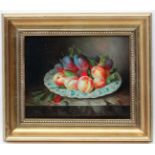 Mid XX Continental School, Oil on board, Still Life of fruit on a china dish on a stone ledge,