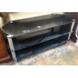 3 tier glass TV stand CONDITION: Please Note - we do not make reference to the