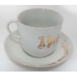 Cup and saucer set inscribed 'present from Oxford ' CONDITION: Please Note - we do
