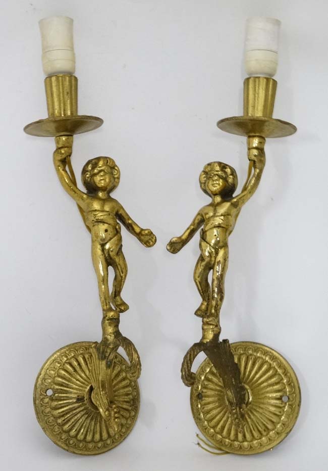 A pair of metal wall lights -with cherub decoration CONDITION: Please Note - we do