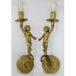 A pair of metal wall lights -with cherub decoration CONDITION: Please Note - we do