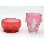 A cranberry glass salt together with a small cranberry glass beaker with Mary Gregory style