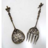 A pair of brass and silver plate servers ( fork and spoon) with cast decoration.