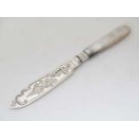 Mother of pearl handled silver butter knife with silver and tortoiseshell military brooch (2)