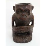 An African Native Ethnographic Tribal carved wooden pot in the form of a chimpanzee.