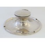 A large silver capstan inkwell hallmarked Birmingham 1909 maker A & J Zimmerman.