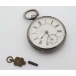 Pocket Watch : A silver cased Key wind Pocket watch having a silver dial with inset seconds dial at