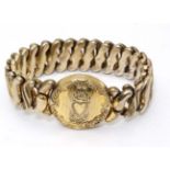 An American gold plated expanding bracelet with circular section. Marked ' Phoenix Speidel Made '.