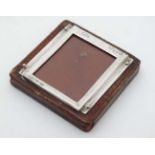 A desk top leather covered paperweight with silver mount to top for miniature photograph / calendar