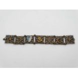A Continental gilt metal bracelet set with pharaoh crescent moon and star decoration and enamel